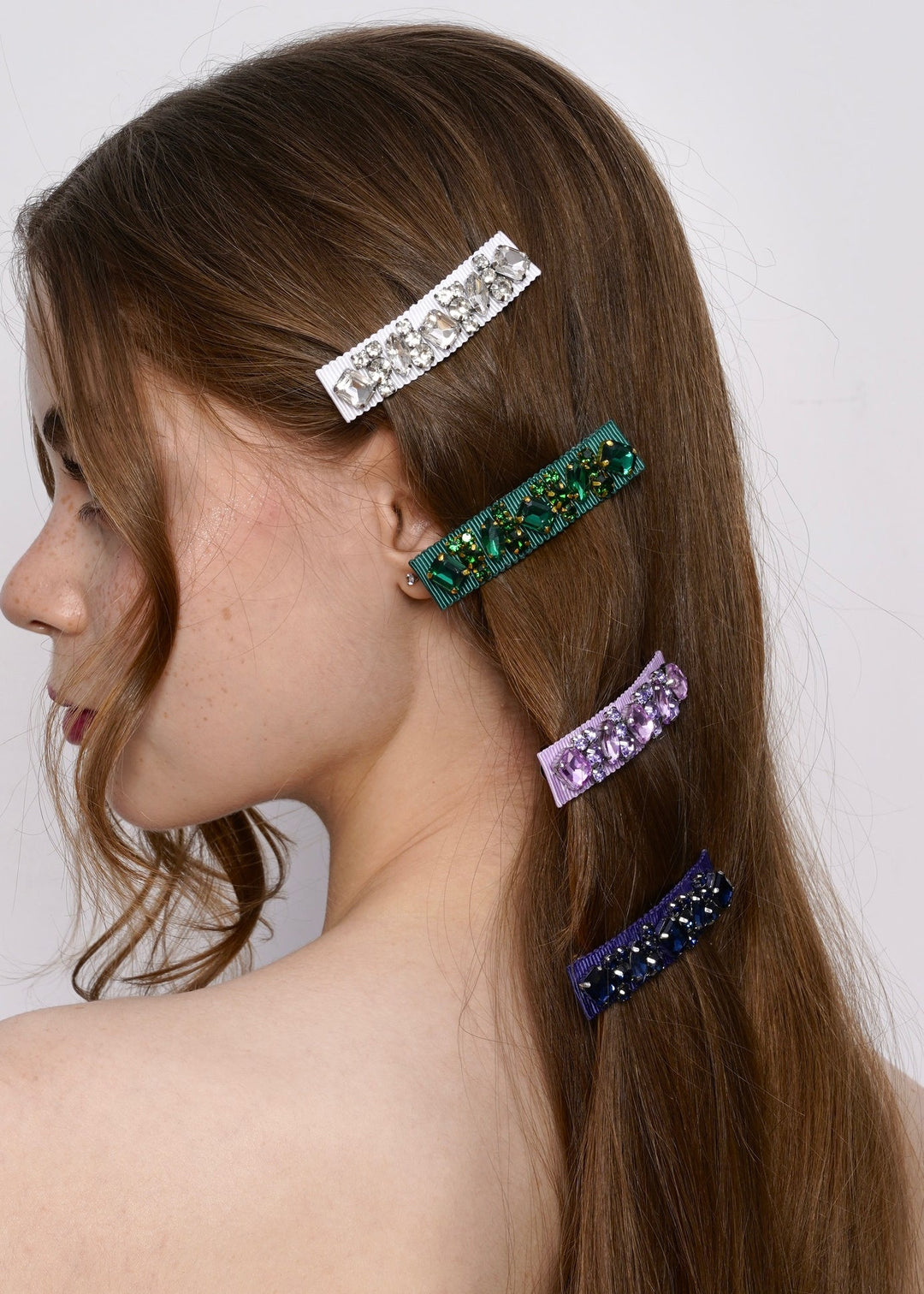 Model wearing Lauren crystal hair barrettes in a half up style, Luvertta