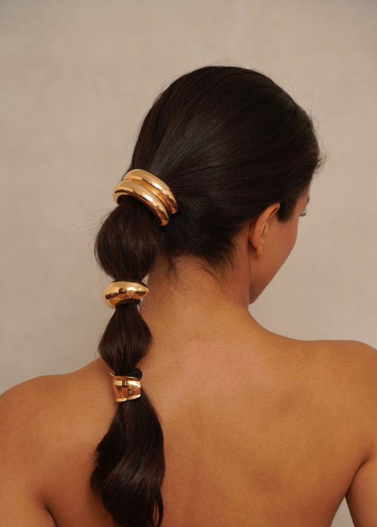 Model showcasing 18k gold plated large cuff with a polished finish